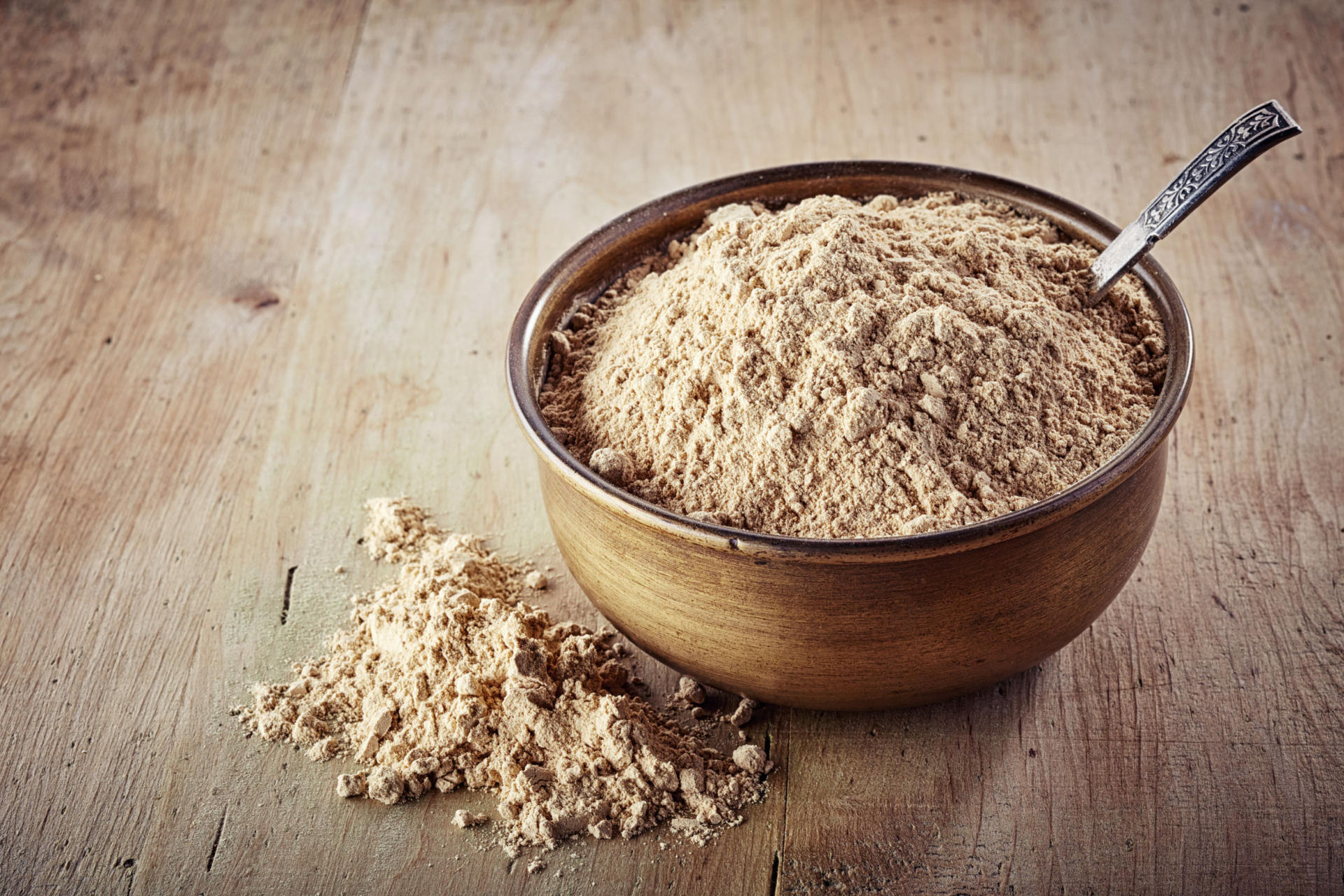 43470422 - bowl of maca powder on wooden background